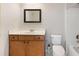 Traditional bathroom features a framed mirror, built-in vanity, and standard toilet and shower at 2536 Kachina Trl, Dacula, GA 30019
