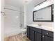Cozy bathroom with shower and tub featuring modern fixtures and stylish vanity at 2536 Kachina Trl, Dacula, GA 30019