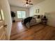 Bedroom showcasing a bed and bedside table, complemented by a large window at 2536 Kachina Trl, Dacula, GA 30019