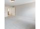 Large, carpeted bedroom showing an open door and staircase access at 2536 Kachina Trl, Dacula, GA 30019