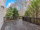 Spacious deck with a view of the backyard trees offers outdoor entertainment space at 2536 Kachina Trl, Dacula, GA 30019