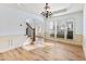 Spacious dining room with wood floors, chandelier, and white wainscoting at 2536 Kachina Trl, Dacula, GA 30019