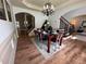 Formal dining room boasting a decorative chandelier and hardwood floors at 2536 Kachina Trl, Dacula, GA 30019