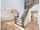 Foyer with staircase and chandelier, showcasing an open-concept layout and elegant design at 2536 Kachina Trl, Dacula, GA 30019