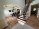 Foyer featuring a staircase and view into the dining room, creating a grand entrance at 2536 Kachina Trl, Dacula, GA 30019