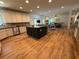 Open-concept kitchen featuring white cabinets, stainless appliances, and a center island at 2536 Kachina Trl, Dacula, GA 30019
