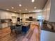 Large kitchen features white cabinetry, stainless appliances, island with barstool seating at 2536 Kachina Trl, Dacula, GA 30019