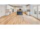Spacious kitchen with white cabinets, stainless steel appliances, and a large island at 2536 Kachina Trl, Dacula, GA 30019