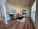 Cozy living room with hardwood floors, natural lighting, and neutral-colored walls at 2536 Kachina Trl, Dacula, GA 30019