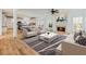 Bright and open living room with fireplace and views into the modern kitchen with an island at 2536 Kachina Trl, Dacula, GA 30019