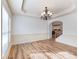 Open living room with decorative ceiling trim and hardwood floors at 2536 Kachina Trl, Dacula, GA 30019