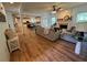 Inviting living room with an open floor plan, fireplace, and hardwood flooring at 2536 Kachina Trl, Dacula, GA 30019