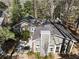 Aerial view of the home, showcasing the screened porch, patio, mature trees, and well-maintained landscaping at 2630 Orchard Knob Se, Atlanta, GA 30339