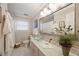 Bathroom featuring a glass vessel sink, marble floors, and spa-like ambiance at 2630 Orchard Knob Se, Atlanta, GA 30339