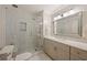 Modern bathroom featuring a glass-enclosed shower with marble tiling and a single sink vanity at 2630 Orchard Knob Se, Atlanta, GA 30339