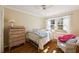 Bright bedroom featuring hardwood floors, large windows, and traditional furnishings at 2630 Orchard Knob Se, Atlanta, GA 30339