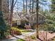 Charming home exterior featuring well-maintained landscaping, mature trees, and a welcoming front entrance at 2630 Orchard Knob Se, Atlanta, GA 30339