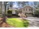 Charming two-story home featuring a well-manicured front yard and a two-car garage at 2630 Orchard Knob Se, Atlanta, GA 30339