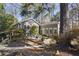 Charming backyard with stone patio, mature trees, and private seating at 2630 Orchard Knob Se, Atlanta, GA 30339