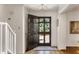 Inviting foyer with hardwood floors and a view of the front yard through the glass-paneled door at 2630 Orchard Knob Se, Atlanta, GA 30339