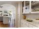 Bright kitchen with white cabinetry, stainless steel appliances, and a marble countertop at 2630 Orchard Knob Se, Atlanta, GA 30339