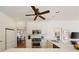 Modern kitchen with white cabinets, stainless steel appliances and large marble island at 2630 Orchard Knob Se, Atlanta, GA 30339