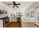 Bright kitchen with white cabinetry, stainless steel appliances, and a large marble countertop at 2630 Orchard Knob Se, Atlanta, GA 30339