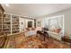Spacious living room with built-in bookshelves and a comfortable seating area by the bay window at 2630 Orchard Knob Se, Atlanta, GA 30339