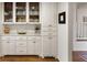 A well-organized pantry featuring white cabinets and marble countertops offers ample storage at 2630 Orchard Knob Se, Atlanta, GA 30339