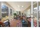 Inviting sunroom filled with natural light and comfortable seating for relaxation at 2630 Orchard Knob Se, Atlanta, GA 30339