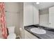 Bathroom with a new vanity, new toilet, and decorative shower curtain at 3136 Taffy Ln, Snellville, GA 30039