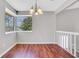 Bright dining room features beautiful floors, a large window, and a modern chandelier at 3136 Taffy Ln, Snellville, GA 30039