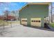 Exterior shot of a two car garage attached to the house with a large driveway at 3136 Taffy Ln, Snellville, GA 30039