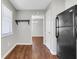 Eat-in kitchen with black appliances and wood look floors at 3136 Taffy Ln, Snellville, GA 30039