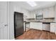 Cozy kitchen features black appliances, white cabinets and plenty of storage space at 3136 Taffy Ln, Snellville, GA 30039