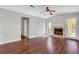Inviting living room with hardwood floors, neutral paint, fireplace, and ample natural light at 3136 Taffy Ln, Snellville, GA 30039