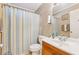 Cozy bathroom featuring a shower, toilet, and sink with ample natural light at 4453 Abingdon Dr, Stone Mountain, GA 30083