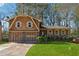 Charming two-story home with a well-manicured front lawn, garage, and inviting porch at 4453 Abingdon Dr, Stone Mountain, GA 30083