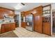 Well-equipped kitchen with wood cabinetry, stainless steel appliances, and ample counter space at 4453 Abingdon Dr, Stone Mountain, GA 30083