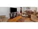 Comfortable living room with hardwood floors, modern TV, and glass table at 4453 Abingdon Dr, Stone Mountain, GA 30083