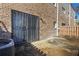 Enclosed backyard patio area with door to the home plus an air conditioning unit at 4701 Flat Shoals Rd # 49C, Union City, GA 30291