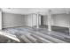Large finished basement with stylish flooring, support columns, and two closet doors at 4701 Flat Shoals Rd # 49C, Union City, GA 30291