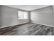 Bedroom featuring gray plank flooring and a window allowing ample natural light at 4701 Flat Shoals Rd # 49C, Union City, GA 30291