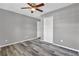A spacious bedroom features modern gray walls and complementary wood-look flooring at 4701 Flat Shoals Rd # 49C, Union City, GA 30291