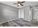 Bedroom features gray walls, wood-look floors, and a standard double door closet at 4701 Flat Shoals Rd # 49C, Union City, GA 30291