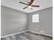 Bedroom featuring wood-look floors, a modern ceiling fan, and a bright window at 4701 Flat Shoals Rd # 49C, Union City, GA 30291