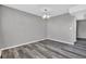 Dining area with a chandelier and gray plank flooring at 4701 Flat Shoals Rd # 49C, Union City, GA 30291