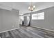 Dining room showing stainless appliances and gray plank flooring at 4701 Flat Shoals Rd # 49C, Union City, GA 30291