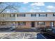 Two-story townhome with a mix of stone and siding accents and paved parking spaces at 4701 Flat Shoals Rd # 49C, Union City, GA 30291