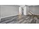 Room with stylish gray wood-look flooring and a staircase at 4701 Flat Shoals Rd # 49C, Union City, GA 30291